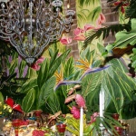 Our floral designer tied in flowers on the table with the flowers in the mural