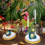 Our floral designer tied in flowers on the table with the flowers in the mural