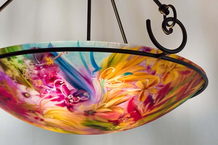 Tropical Paradise is a hand painted chandelier by Jenny Floravita. Forged fixture shown here is Floravita's Contemporary Swirl and has a height of 29 inches as pictured. This fixture style also comes in shorter heights. Installation ready.