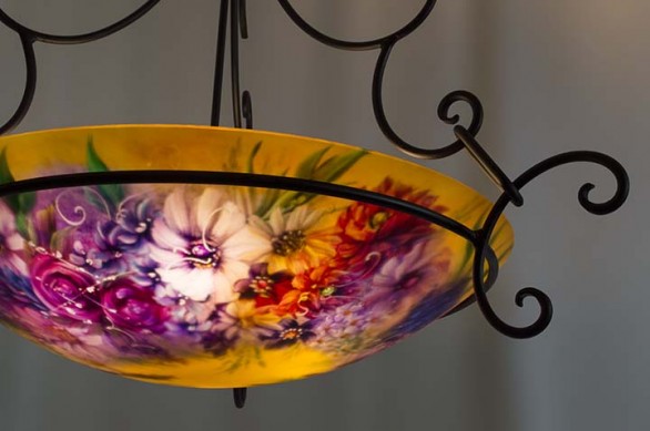 Roses, wildflowers and white accent flowers dance in the sunshine in Jenny Floravita's new painted glass chandelier.